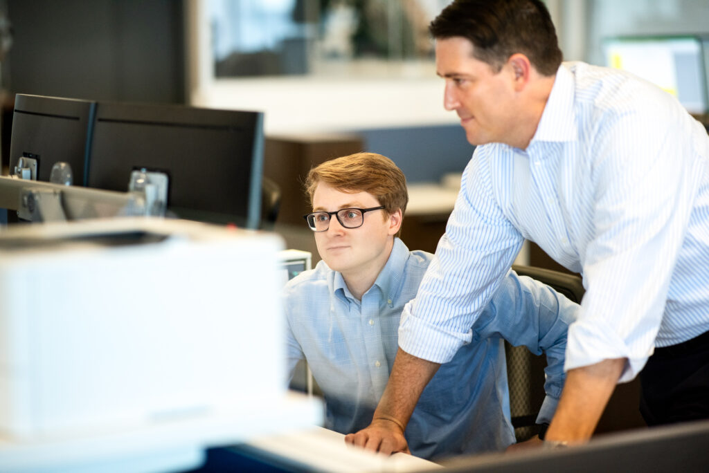 Corporate Lifestyle image of bankers working at a computer in Los Angeles.