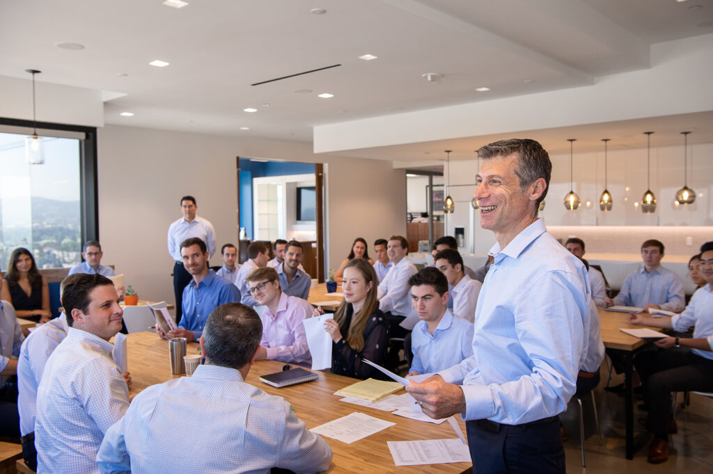 Banking executives attend a large group meeting in an office in Los Angeles, Calif.