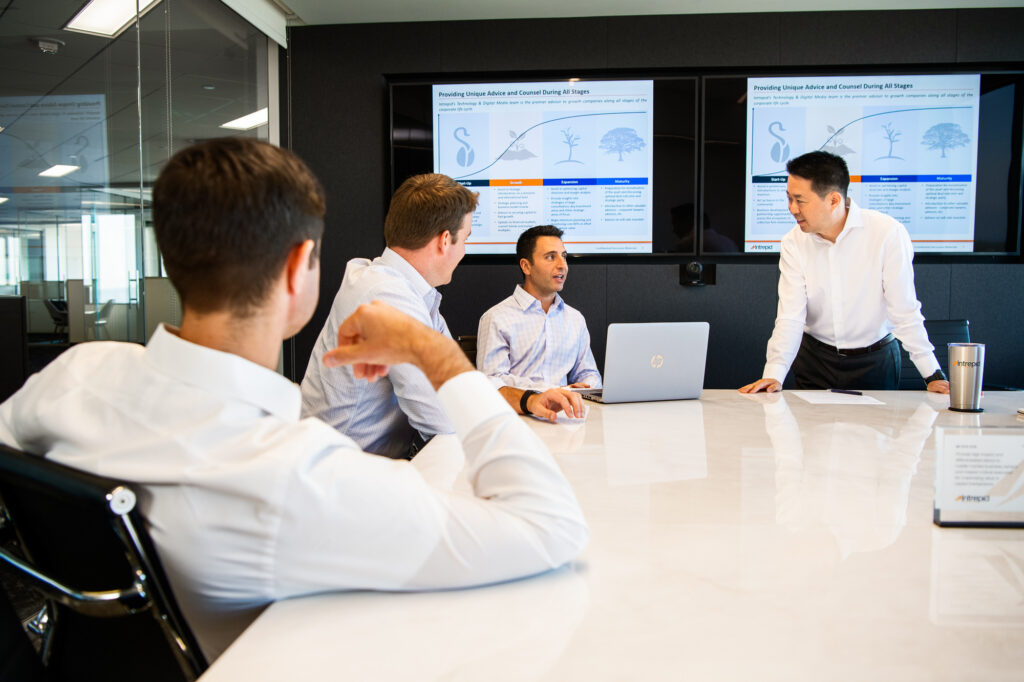 Businessmen meet in a conference room in Santa Monica.