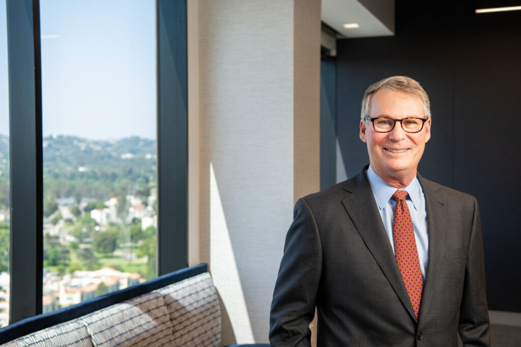 Banking executive environmental portrait in Los Angeles boardroom.