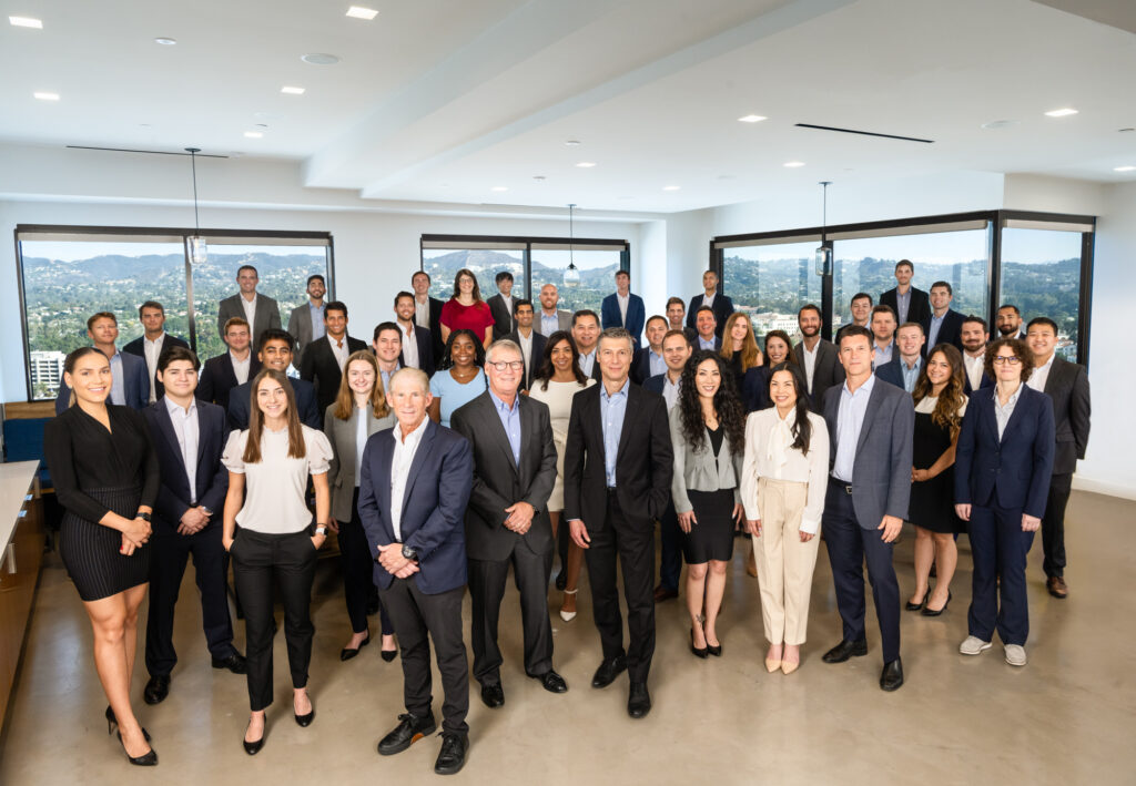 A large group portrait of an investment banking firm in Los Angeles.