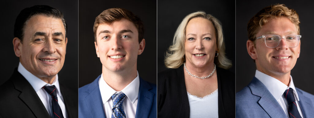 Corporate headshots of bankers against a black backdrop.